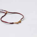 Pinky Promise Lucky Charm 2026 bracelet gold with burgundy thread